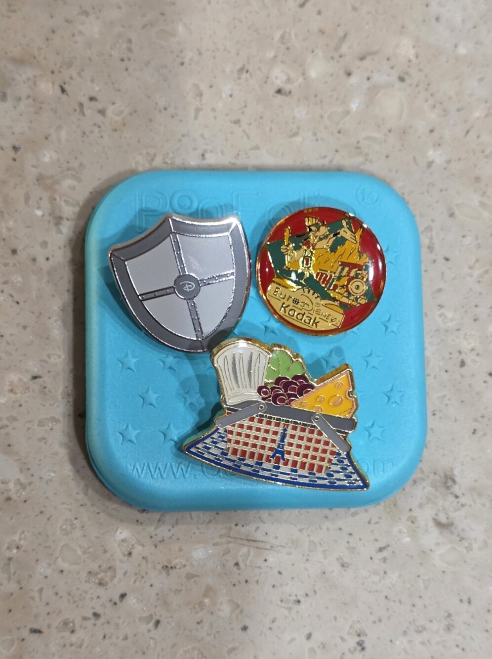 Three random authentic disney pins And PinFolio QTboard